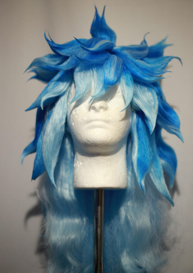 bright and light blue wig styled to look like iida from twisted wonderland