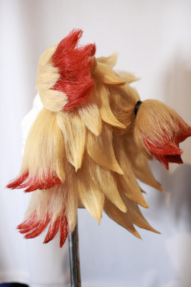 lace front blonde and red cosplay wig styled to look like rengoku from demon slayer