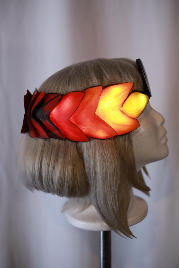 ashy blonde cosplay wig style to look like melinoe from hades, this time the laurel is actually glowing from LEDs inside it