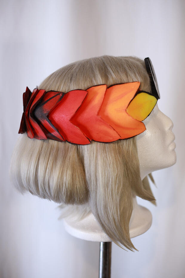 ashy blonde cosplay wig style to look like melinoe from hades, with a laurel made from eva foam painted to look glowy