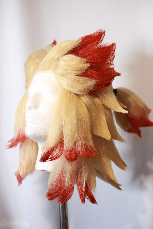lace front blonde and red cosplay wig styled to look like rengoku from demon slayer